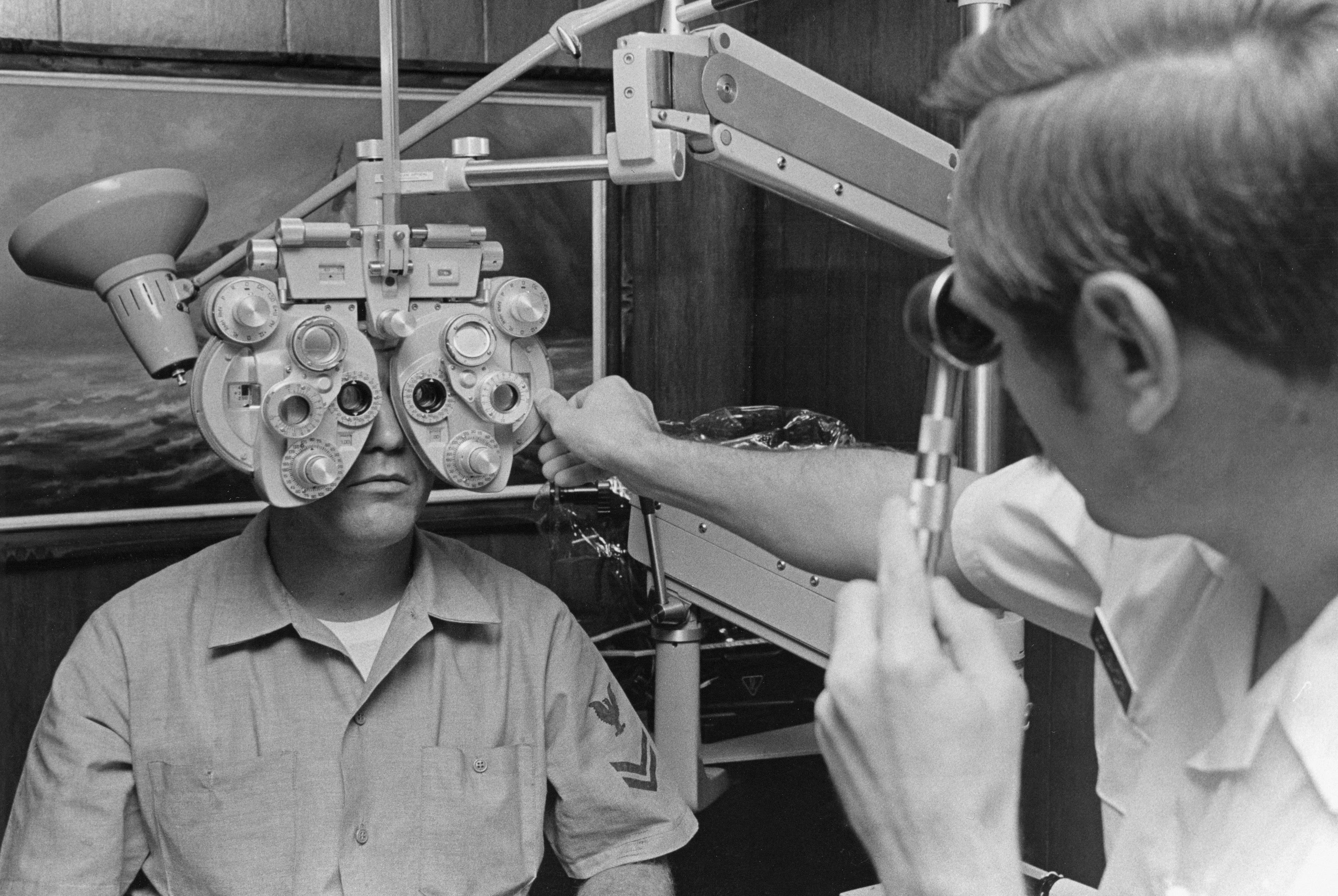 Vintage photograph of an optometrist examining a patient
