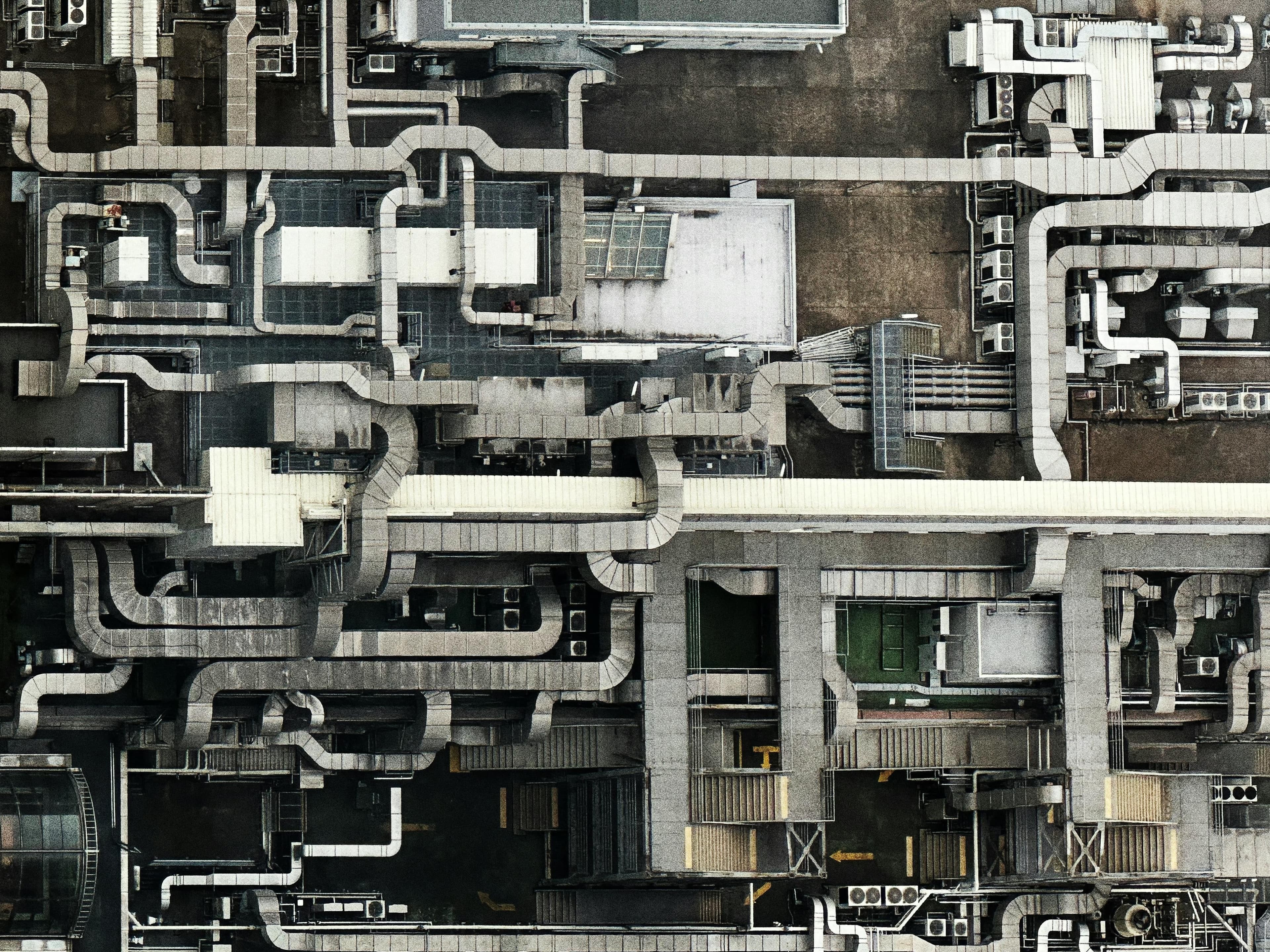Aerial view of interconnected industrial pipes and ducts